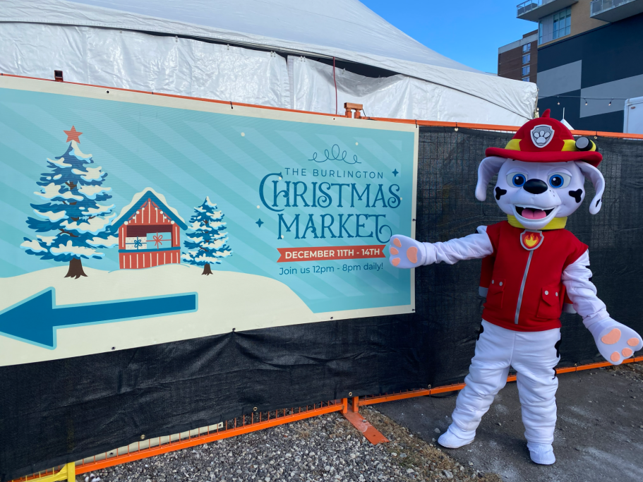 Marshall standing outside the market