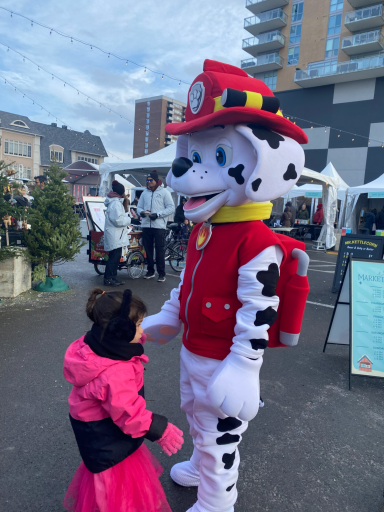 Marshall character greeting kids.